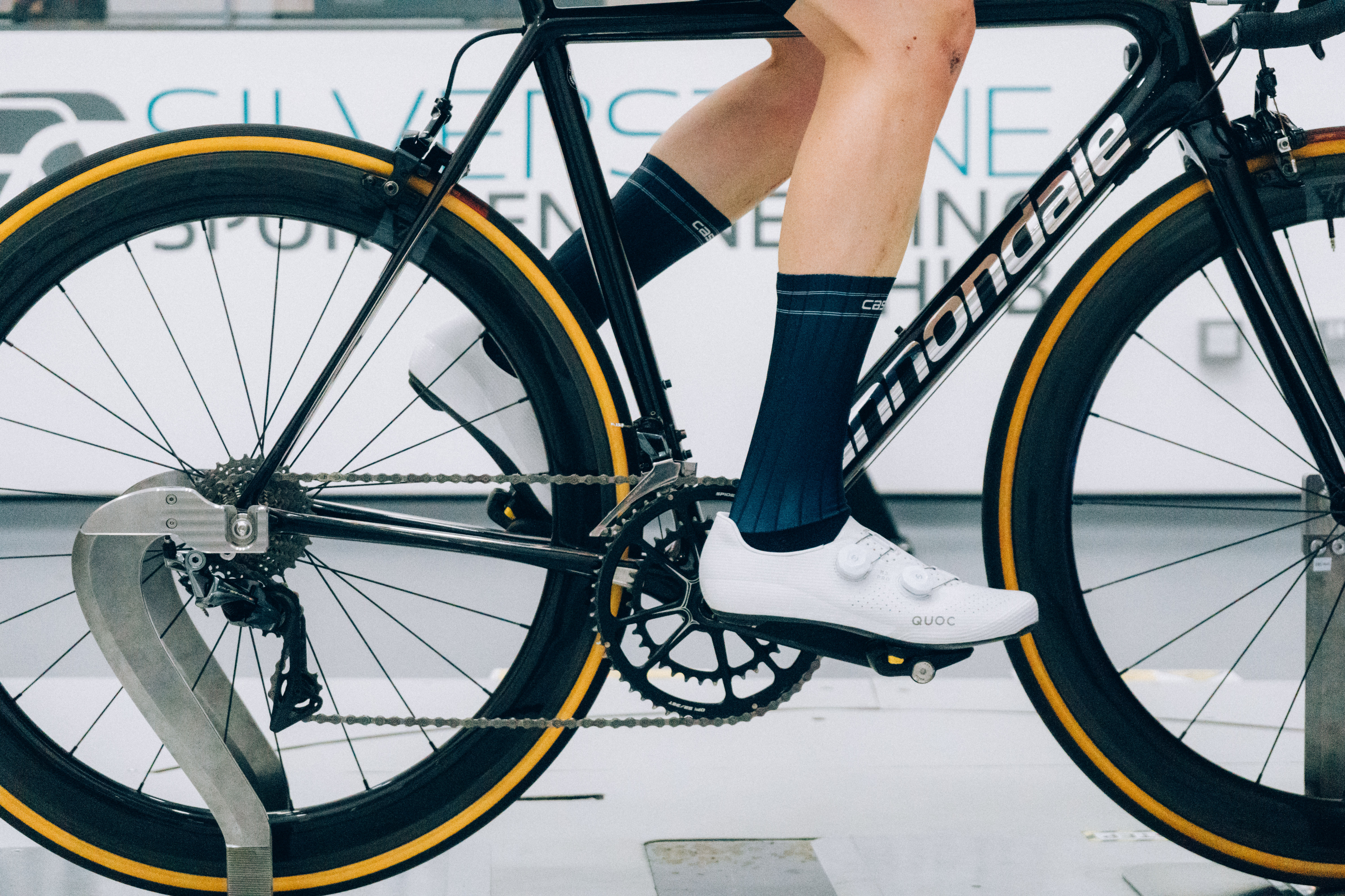A close up of the socks that Tom is wearing while riding a bike in the wind tunnel