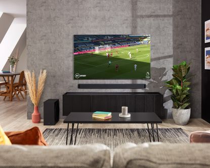 Samsung TV shown with a soundbar in a living room