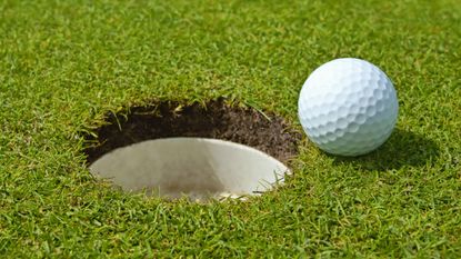 golf hole and ball GettyImages-459362761