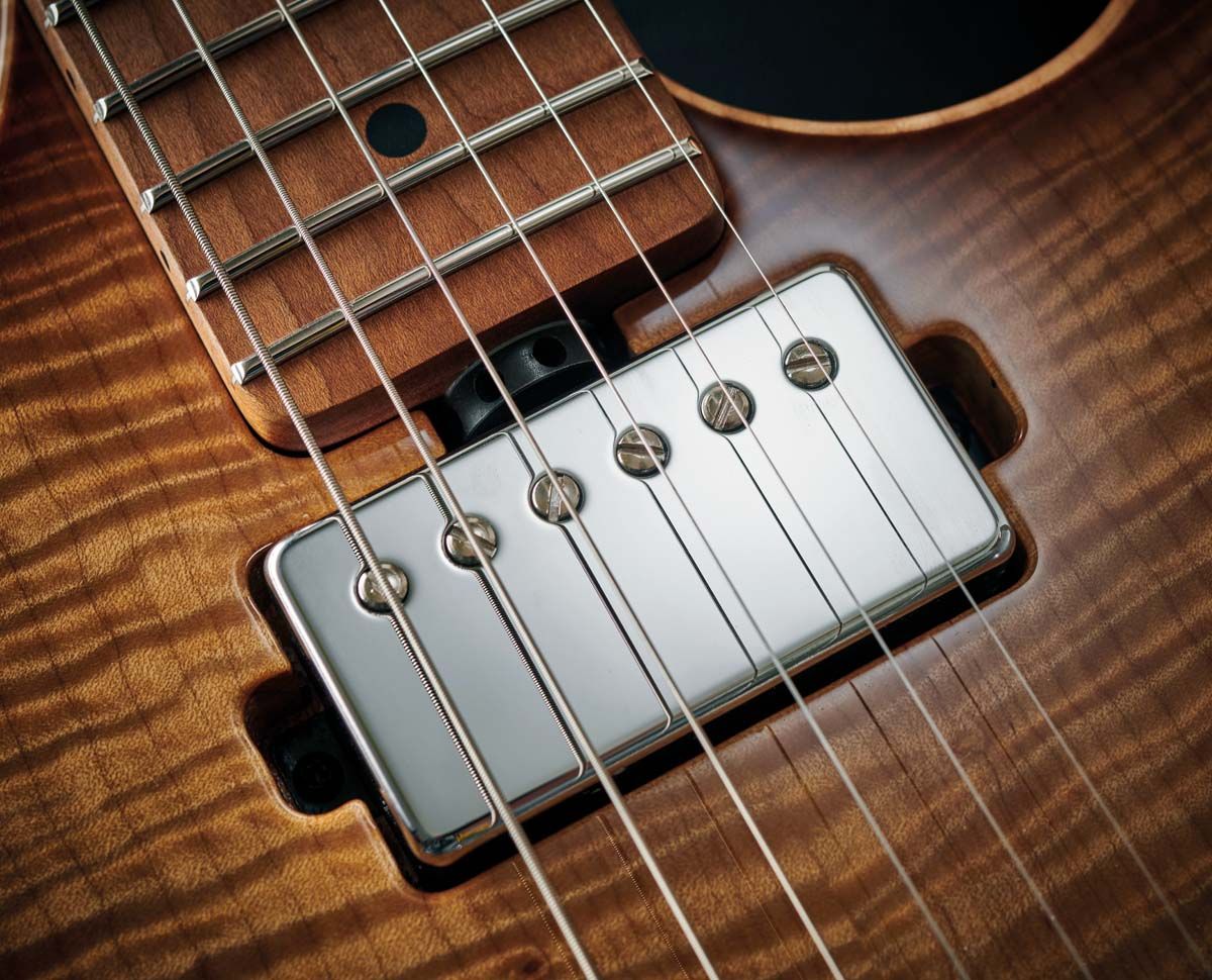 Mounting the truss rod adjuster wheel at the bottom of the neck makes quick tweaks a breeze.