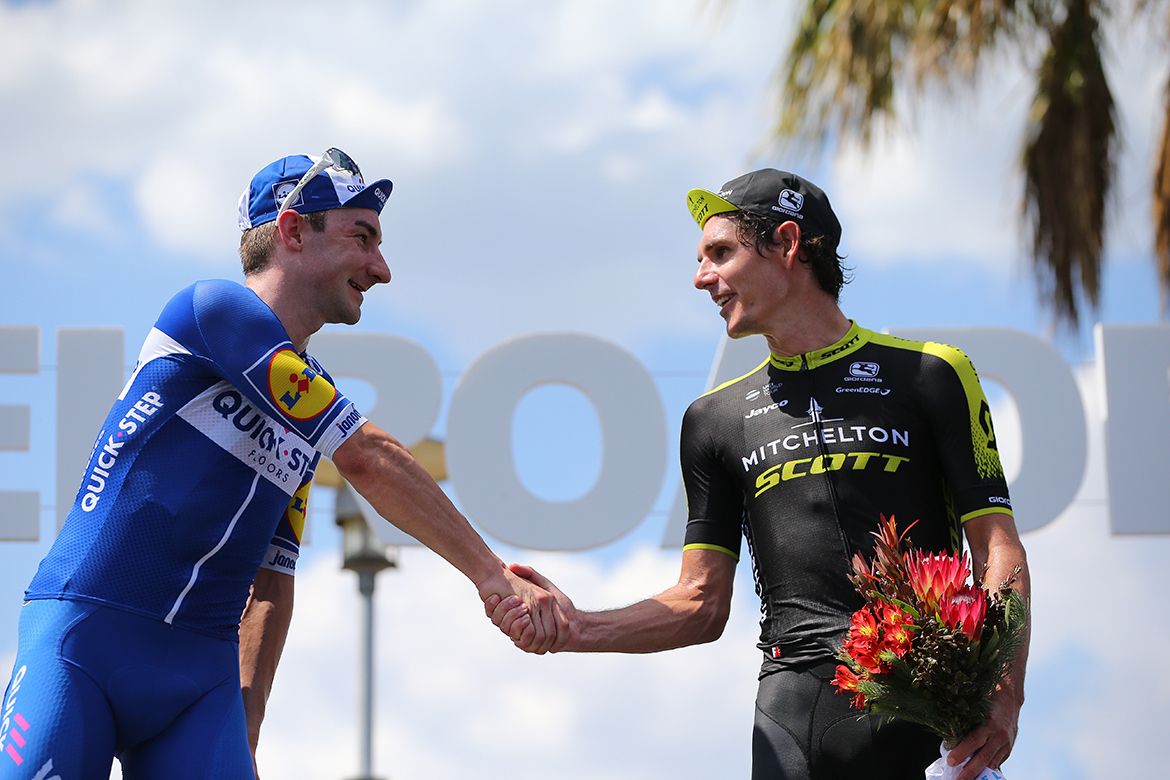 Elia Viviani and Daryl Impey shake hands on the podium