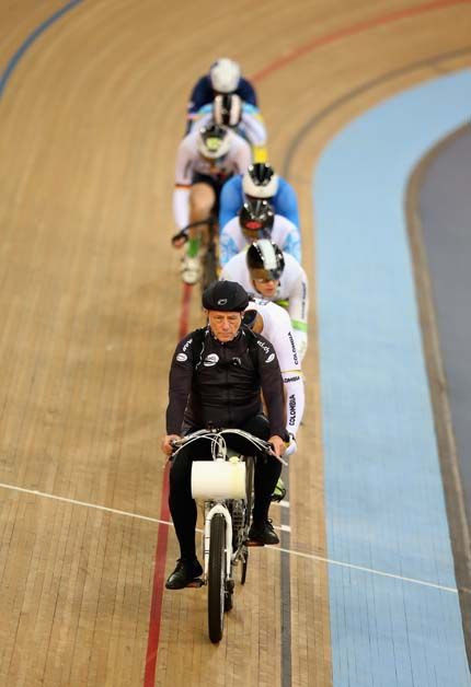 The keirin riders sit behind the derny