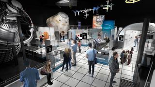 people walk through a museum full of spacecraft displays