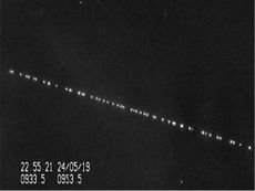 A train of SpaceX Starlink satellites are visible in the night sky in this still from <a href="https://sattrackcam.blogspot.com/2019/05/wowowow-spectacular-view-of-spacex.html">a video captured by satellite tracker Marco Langbroek in Leiden</a>, the Nethe