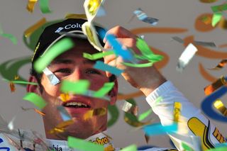 Mark Cavendish of Team Columbia celebrates on the podium winning the 100th Milan-San Remo