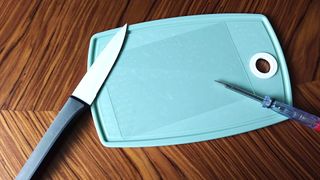 Jsaux screen protector for Steam Deck on cutting board next to kitchen knife and screw driver