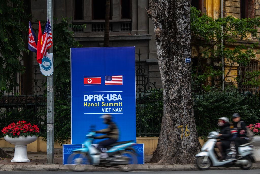  Scooters pass a banner announcing the forthcoming summit between North Korea&amp;#039;s leader Kim Jong-un and U.S President Donald Trump, on February 24, 2019 in Hanoi, Vietnam. 