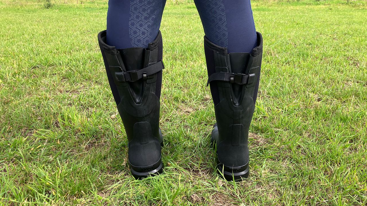 close up back view of model wearing Muck Boot Chore Adjustable Boots