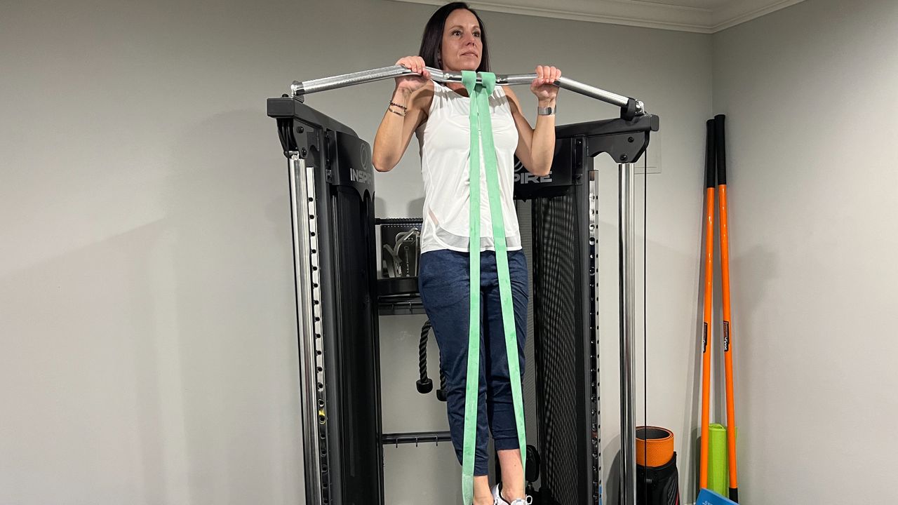 Wendy Batts performing a resistance band pull-up