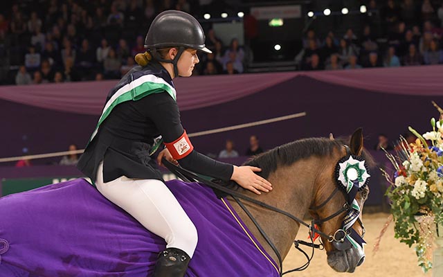 Nicole Lockhead Anderson riding SHAPPEN PILGRIM owned by Claire Lockhead, winner of the 138 cm Championship (Class 8) during HOYS in the NEC in Warwickshire in the UK on 8th October 2016