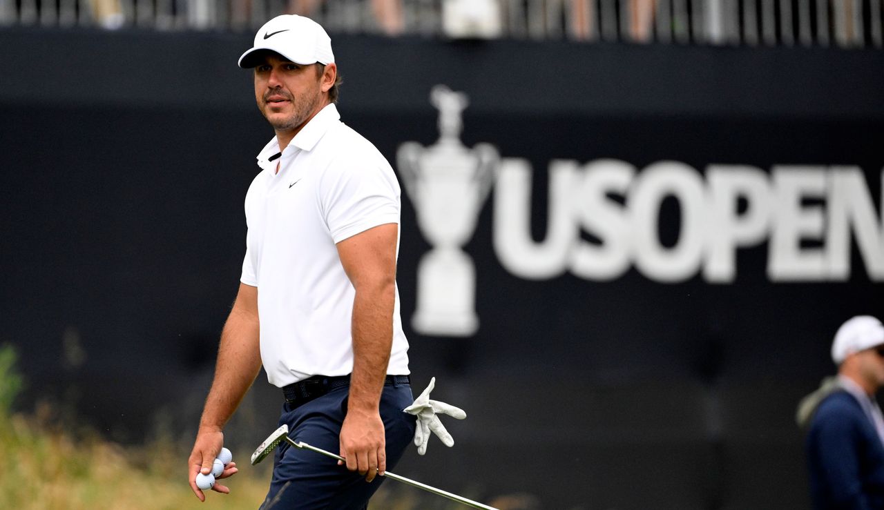 Brooks Koepka in front of a US Open board