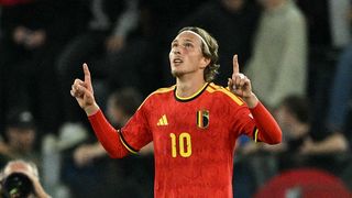 Belgium's forward #10 Mika Godts celebrates scoring his team's first goal during the UEFA Nations League (League A, Group 1) football match between Italy and Belgium at the Olympic Stadium in Rome.