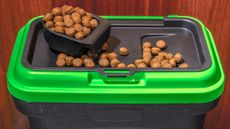Dog food container holding dry dog food