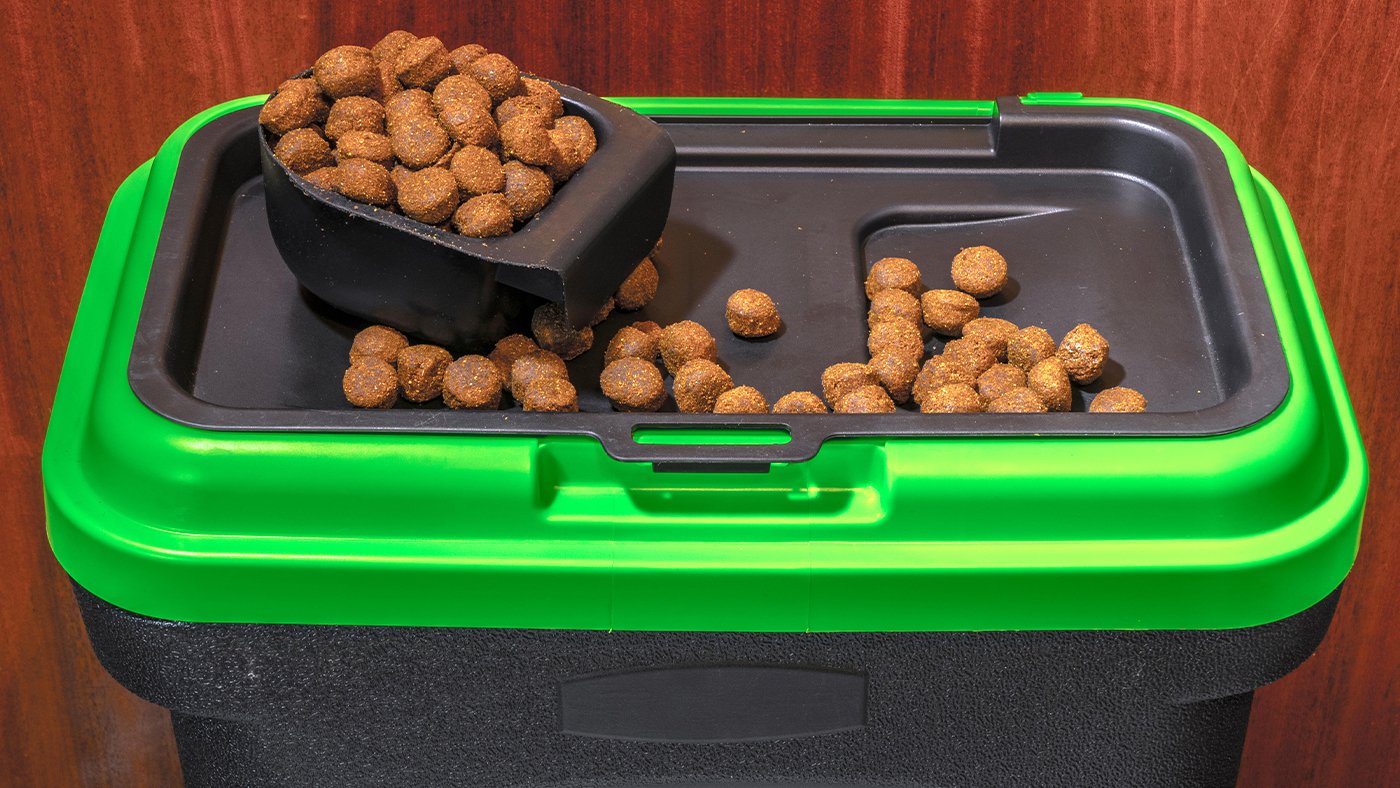 Dog food container holding dry dog food