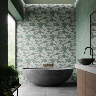 Light filled modern bathroom with a wall of botanical green wallpaper