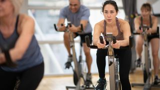 a group of people enjoying a spin class