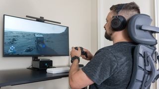 A person playing Death Stranding 2 on the Innocn 40C1R ultrawide monitor