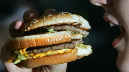 A woman eating a burger