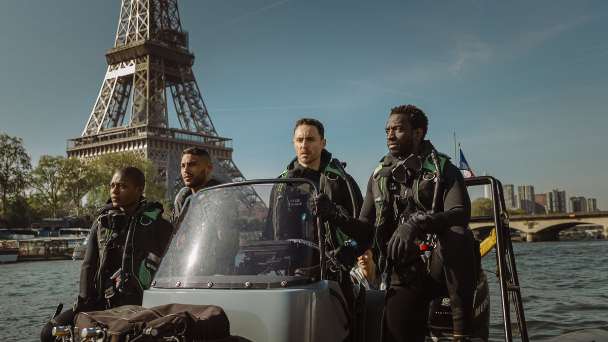 The cast of Under Paris under the Eiffel Tower.