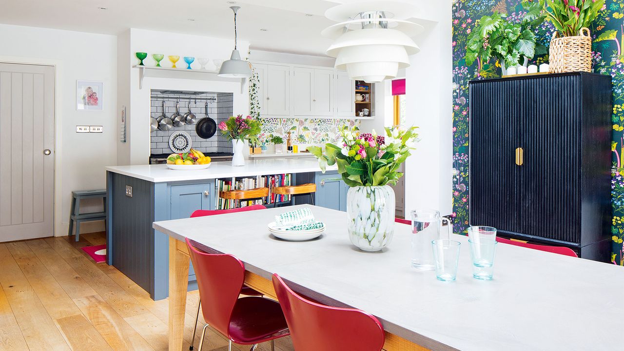 grey and blue kitchen with floral wallpaper