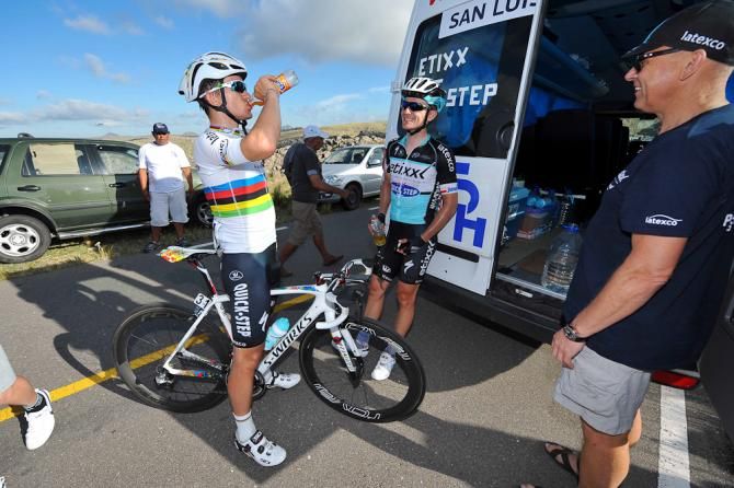 Michal Kwiatkowski hydrates at the Etixx-QuickStep team bus.