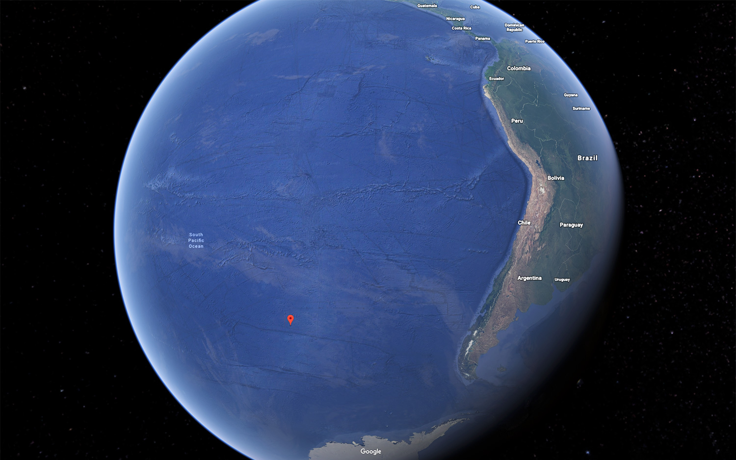 Point Nemo (marked in red) in the south Pacific Ocean is farther from land than any other point on Earth. It is also home to the world's largest "Spacecraft Cemetery."