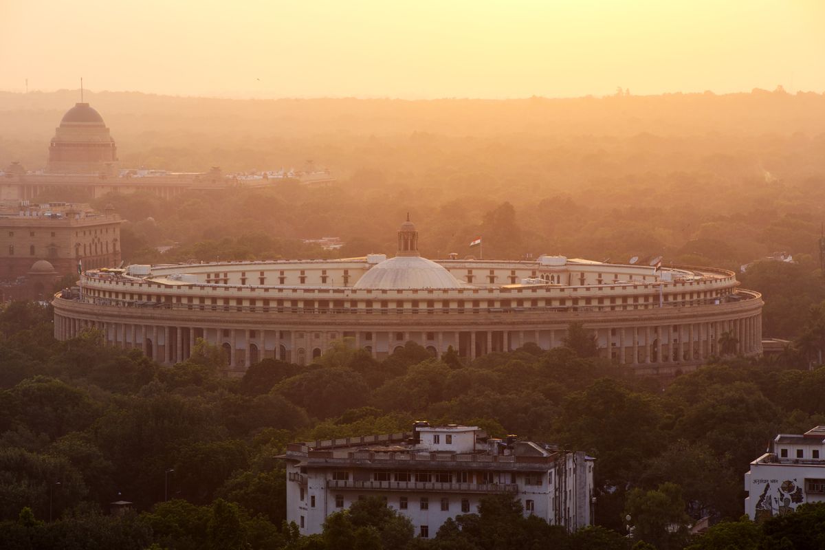 India&amp;#039;s parliament building at sunset