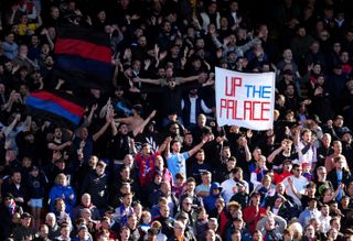 Crystal Palace fans cheer on their team during the Premier League match at Selhurst Park, London. Picture date: Sunday October 3, 2021