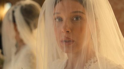 Millie Bobby Brown in Enola Holmes 3 with a wedding veil over her face