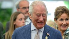 King Charles III smiles during a visit to the RHS Chelsea Flower Show at Royal Hospital Chelsea on May 20, 2025