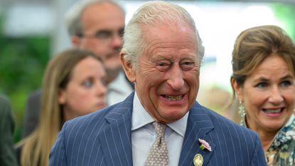 King Charles III smiles during a visit to the RHS Chelsea Flower Show at Royal Hospital Chelsea on May 20, 2025
