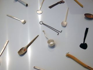 Collection of spoons in silver, wood, steel and tin