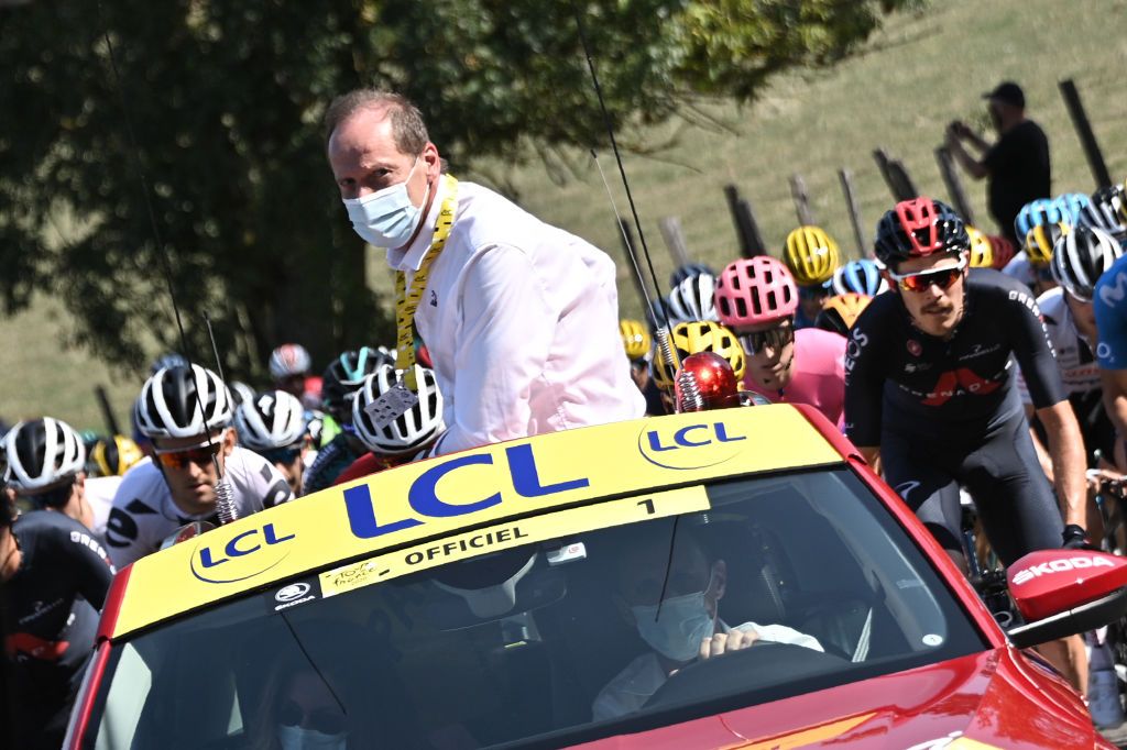 Tour de France director Christian Prudhomme gives the start for the first time after a quarantine as he tested positive for the novel coronavirus Covid19 some days ago during the 16th stage of the 107th edition of the Tour de France cycling race 164 km between La Tour du Pin and VillarddeLans on September 15 2020 Photo by AnneChristine POUJOULAT AFP Photo by ANNECHRISTINE POUJOULATAFP via Getty Images