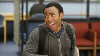 Donald Glover smiling as Troy Barnes in Community