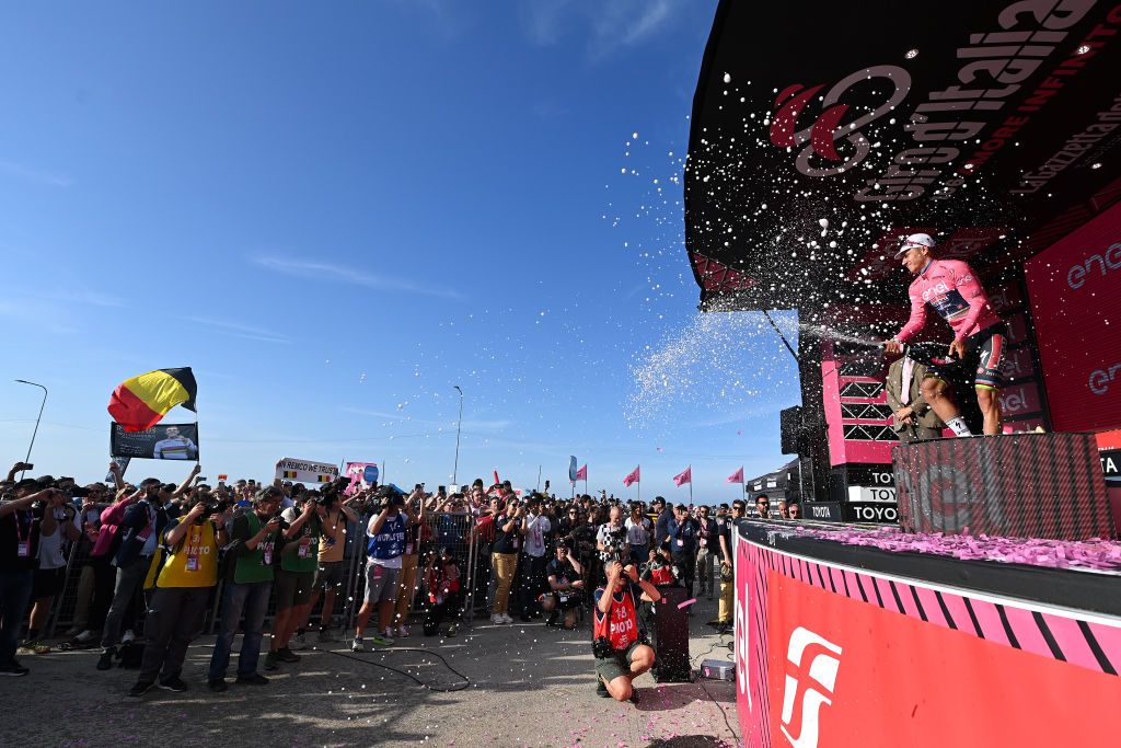 SAN SALVO ITALY MAY 07 Remco Evenepoel of Belgium and Team Soudal Quick Step celebrates at podium as Pink Leader Jersey winner during the 106th Giro dItalia 2023 Stage 2 a 202km stage from Teramo to San Salvo UCIWT on May 07 2023 in San Salvo Italy Photo by Tim de WaeleGetty Images
