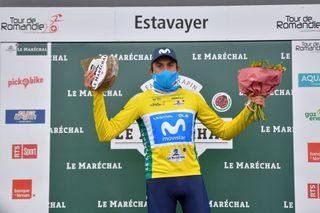 ESTAVAYER SWITZERLAND APRIL 30 Marc Soler Gimenez of Spain and Movistar Team Yellow Leader Jersey celebrates at podium during the 74th Tour De Romandie 2021 Stage 3 a 1687km stage from Estavayer to Estavayer Cheese Trophy Mask Covid safety measures Flowers TDR2021 TDRnonstop UCIworldtour on April 30 2021 in Estavayer Switzerland Photo by Luc ClaessenGetty Images