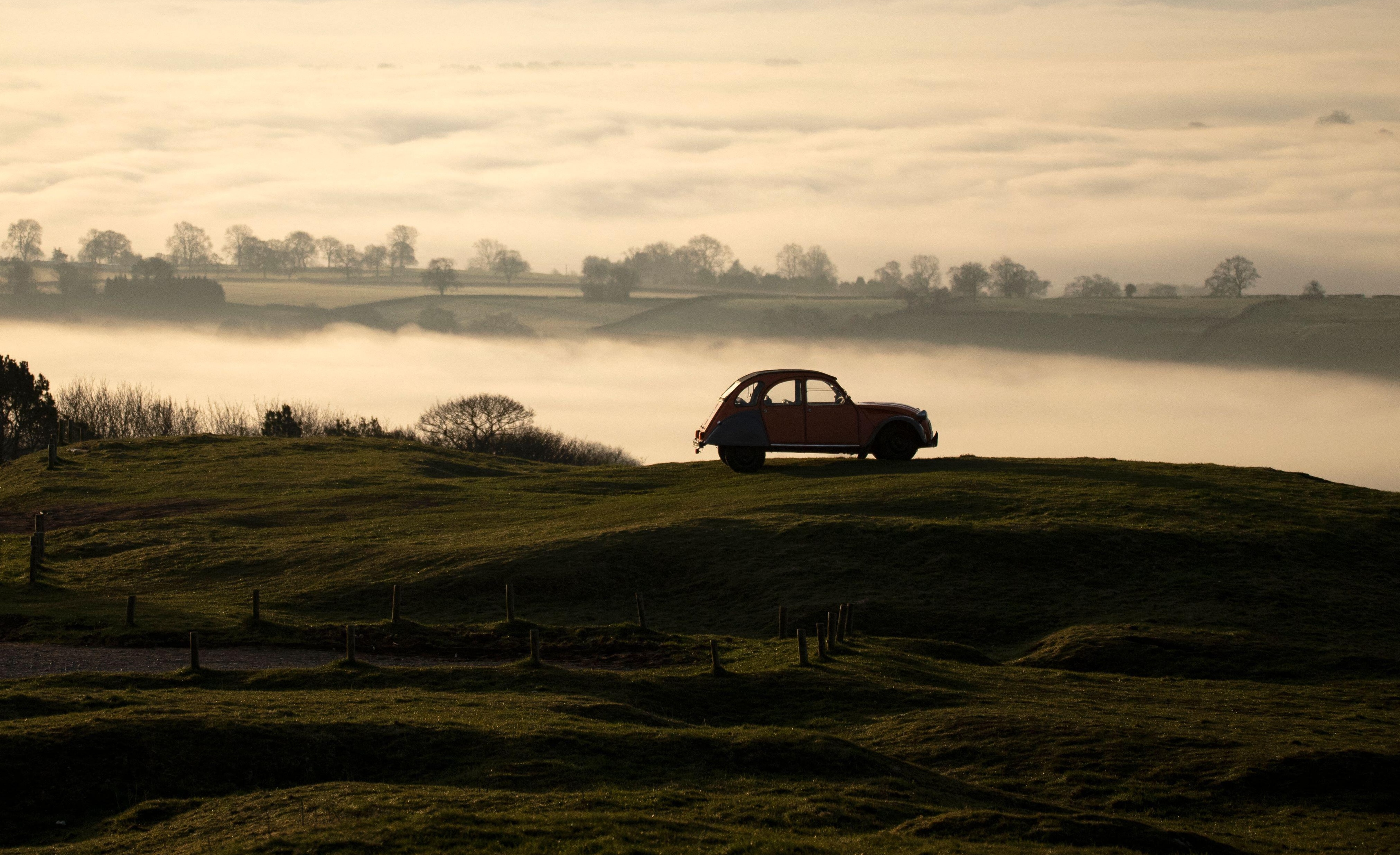 Parked at the top the Weaver Hills, at the southernmost point of the Pennines, a classic Citroen 2cv is silhouetted against a misty dawn 