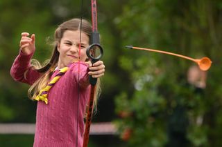 Princess Charlotte doing archery