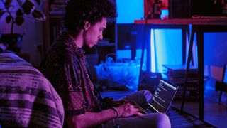 Person coding on computer