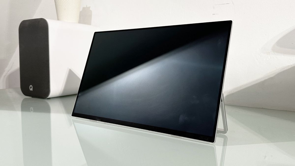 Testing the Acer ProDesigner PE160WUT in a home office next to a MacBook
