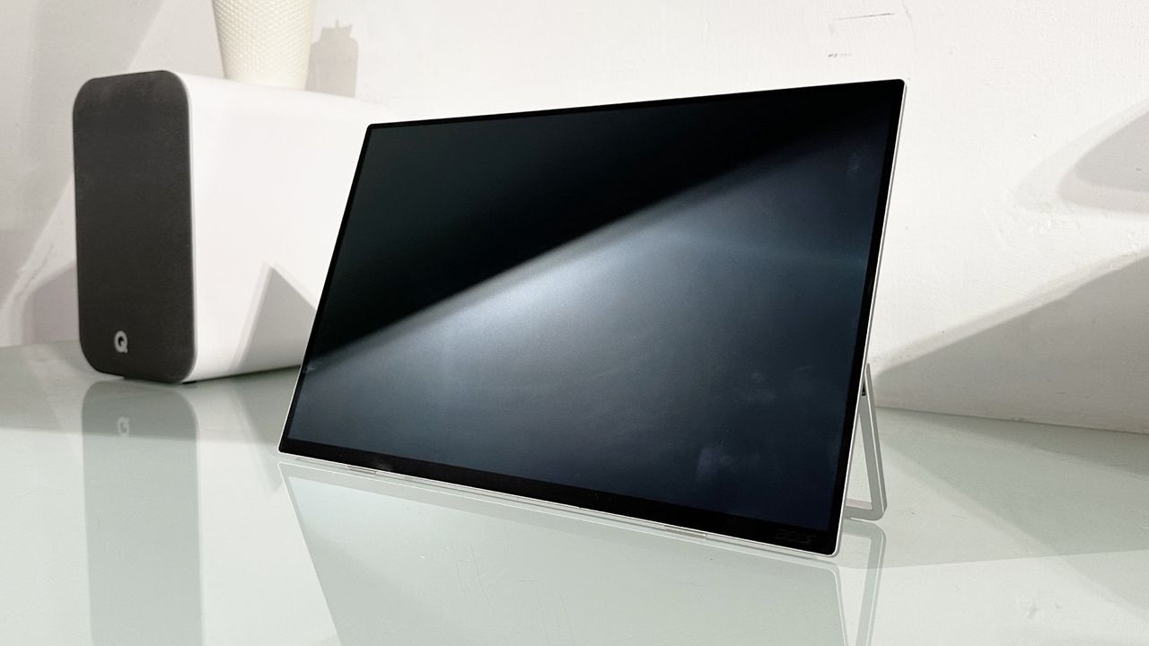 Testing the Acer ProDesigner PE160WUT in a home office next to a MacBook