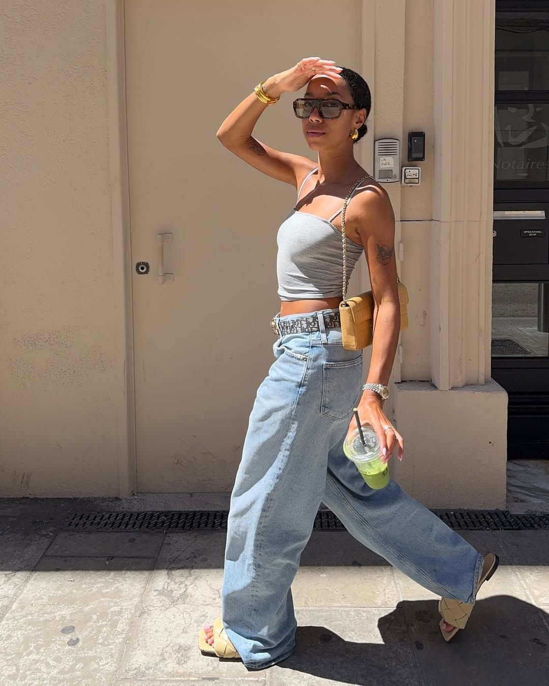 @amaka.hamelijnck wearing wide-leg jeans and tank