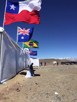 Flags at the groundbreaking ceremony for the Giant Magellan Telescope in Chile on Nov. 11, 2015.