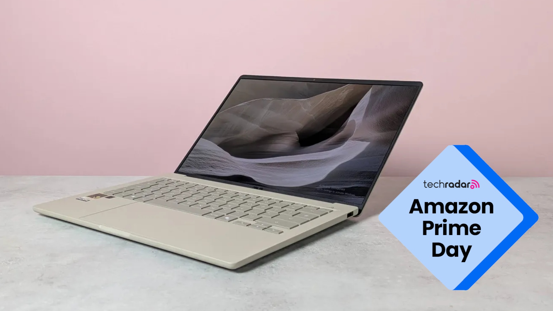 The Asus Zenbook A14 in our strudio during review, with a blue diamond TechRadar badge that reads 'Amazon Prime Day'
