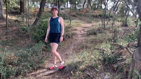 Julia Clarke on forest trail wearing Montane Women&#039;s Ineo Lite shorts