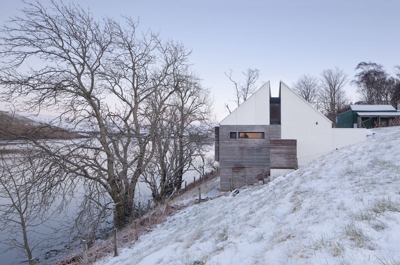 The steepness of the site allowed a basic understorey (just visible above) to be created, and this houses a packaged pumping station to raise the sewage level of the village system, as well as providing covered storage accessible from the garden.