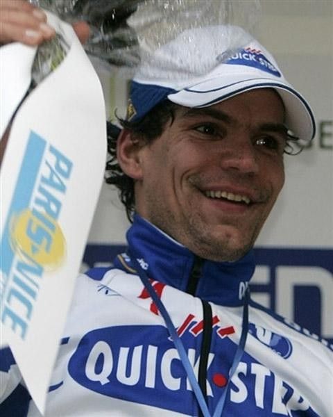 A still soggy Gert Steegmans waves happily from the podium.