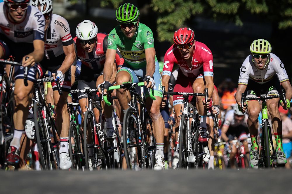 Alexander Kristoff fights to stay in the group on the final cobbled climb before the finish of stage 16