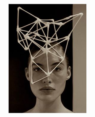 geometric shape on top of model's head