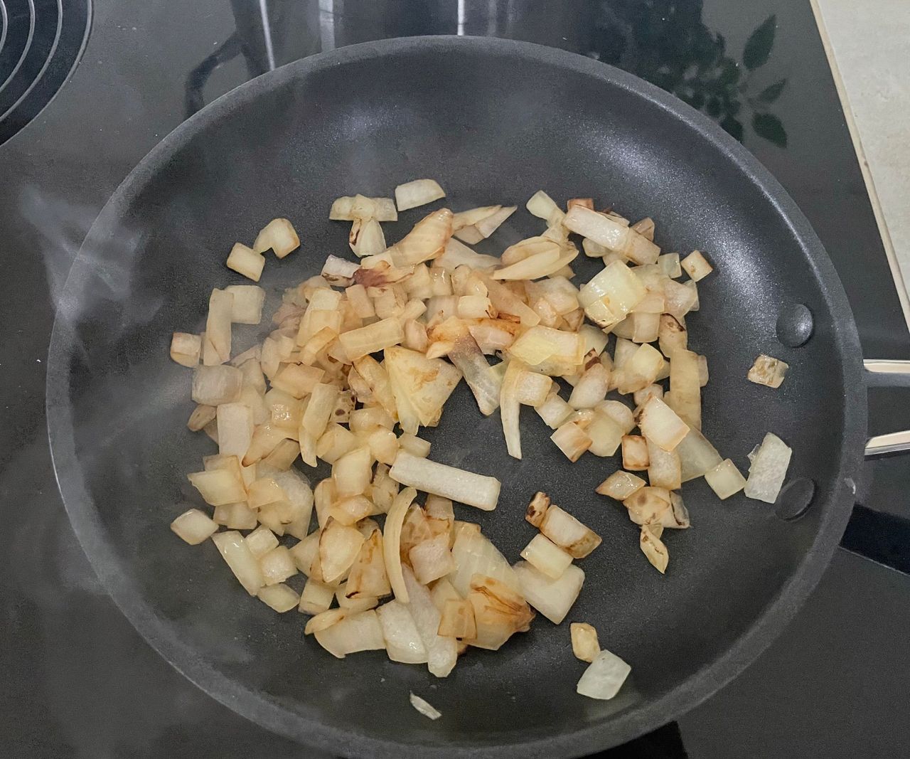 M&amp;S 5-piece Stainless Steel Pan Set frying onions